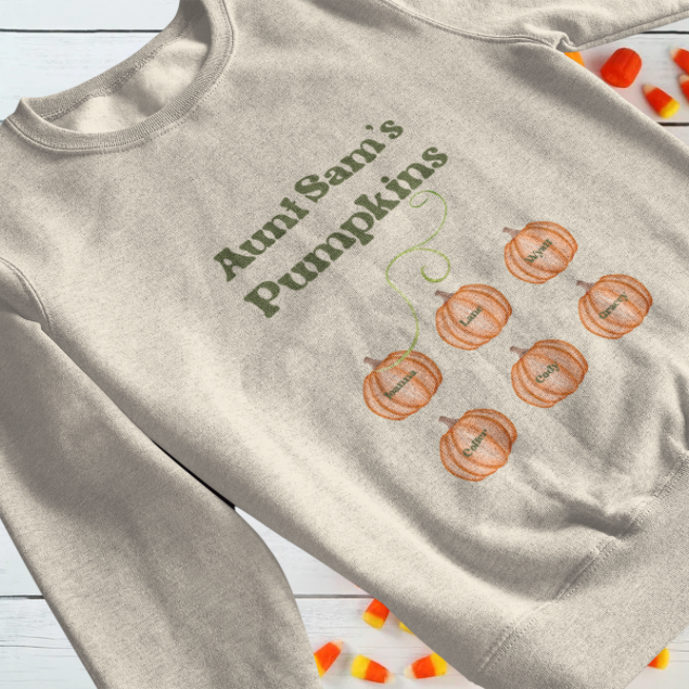 Beige crewneck sweatshirt with printed pumpkin family design and names, custom Mama’s Pumpkins sweatshirt by Made By Ally Adair