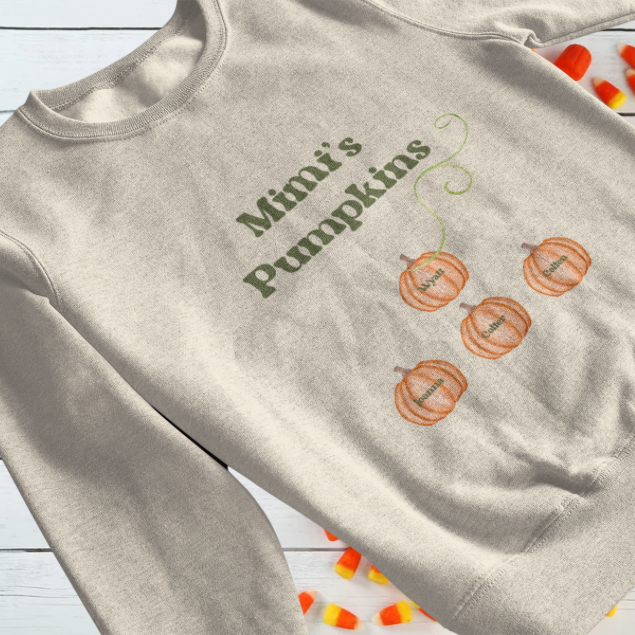custom Mama’s Pumpkins sweatshirt beige crewneck with green text and four personalized orange pumpkin graphics