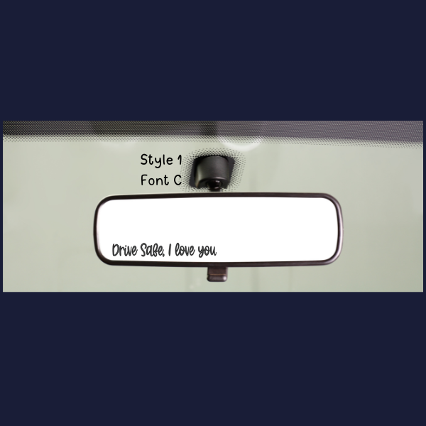 Car rear view mirror showing a personalized rear view mirror sticker for drivers that reads Drive safe I love you