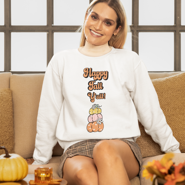 Woman wearing Made By Ally Adair Happy Fall Y’all sweatshirt with pumpkin stack graphic on white pullover