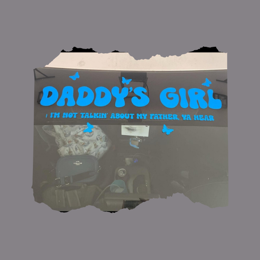Blue vinyl Daddy's Girl car decal with butterflies and humorous small script on a car rear windshield