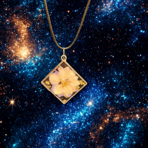 Made By Ally Adair double-sided resin pendant with pressed pink blossom in square gold frame on a chain