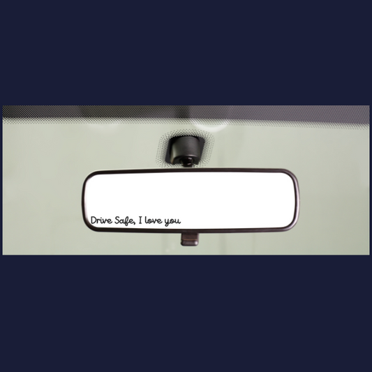 Car rear view mirror showing small Drive Safe I love you decal on bottom edge rear view mirror sticker for drivers