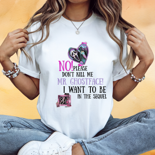 Woman wearing a white Made By Ally Adair Mr. Ghostface graphic t-shirt with colorful heart mask and playful horror text